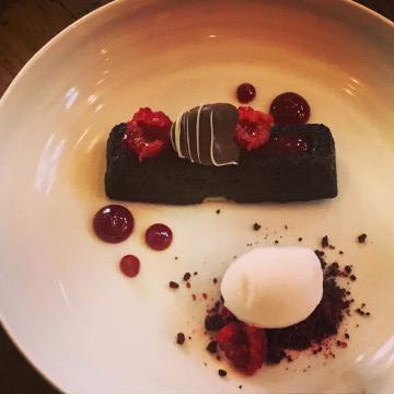 chocolate cake, fresh berries, gelato berry sauce