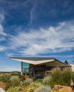 building with landscaping and blue sky