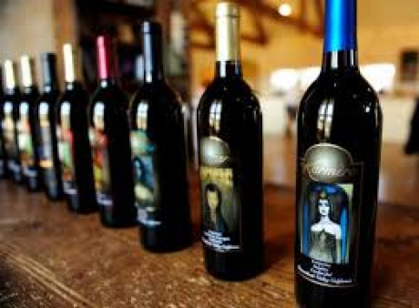 bottles of Karmere winery wines on a wood table top