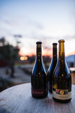 bottles of Turley wine with sunset in background